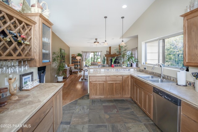 1101 S Milton Ave, Prescott, AZ 86303 - kitchen featuring stainless steel dishwasher, a sink, vaulted ceiling, light countertops, and a peninsula
