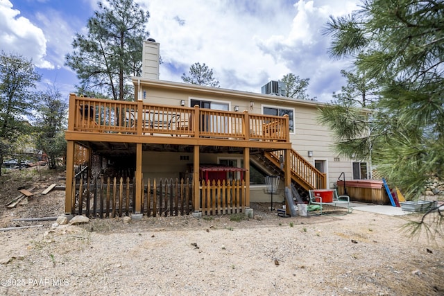 1101 S Milton Ave, Prescott, AZ 86303 - rear view of house featuring a jacuzzi, stairs, a wooden deck, and central air condition unit
