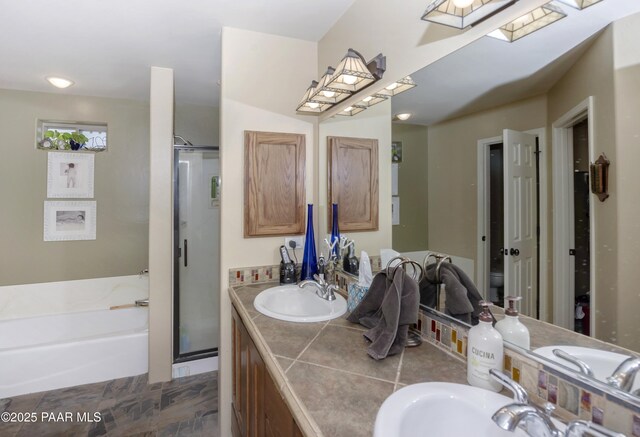 1101 S Milton Ave, Prescott, AZ 86303 - full bathroom with a shower stall, a bath, double vanity, and a skylight