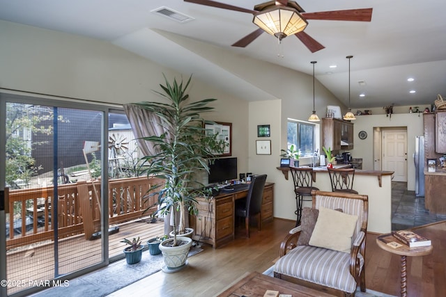 1101 S Milton Ave, Prescott, AZ 86303 - living room featuring vaulted ceiling, plenty of natural light, a desk, wood finished floors, and ceiling fan