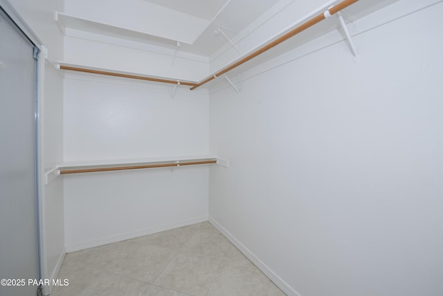 spacious closet with tile patterned flooring