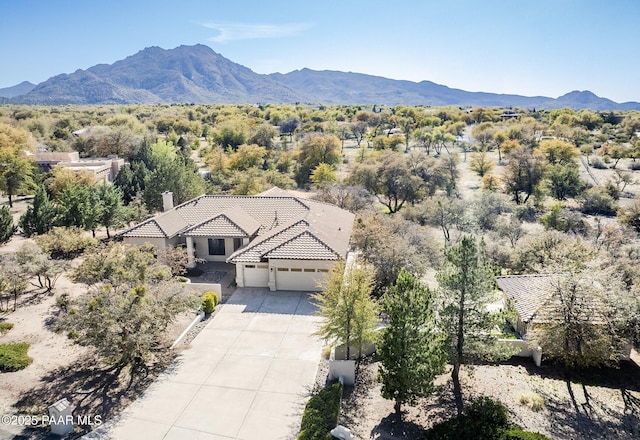 birds eye view of property with a mountain view