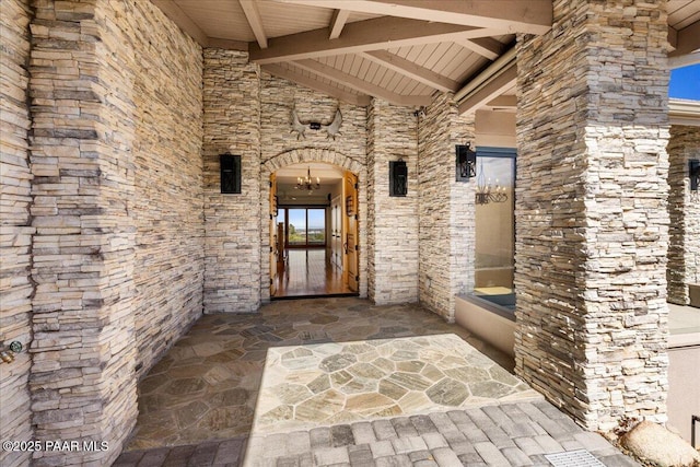 entrance to property with stone siding