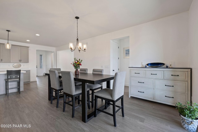 5083 N Kingsley Ct, Prescott Valley, AZ 86314 - dining area with dark wood-style flooring, a chandelier, and recessed lighting