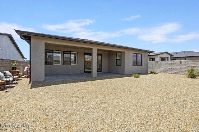 5083 N Kingsley Ct, Prescott Valley, AZ 86314 - back of property featuring stucco siding, a fenced backyard, and a patio
