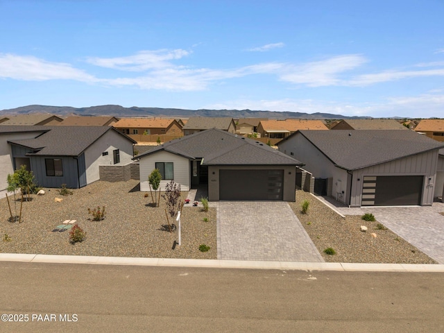 5083 N Kingsley Ct, Prescott Valley, AZ 86314 - view of front of home with a residential view, a mountain view, and a garage