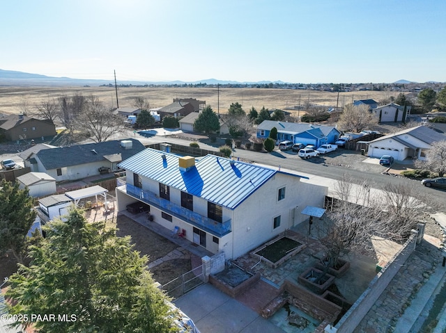 drone / aerial view with a residential view and a mountain view