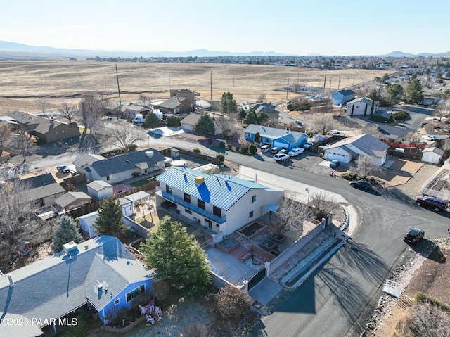 drone / aerial view featuring a residential view and a mountain view