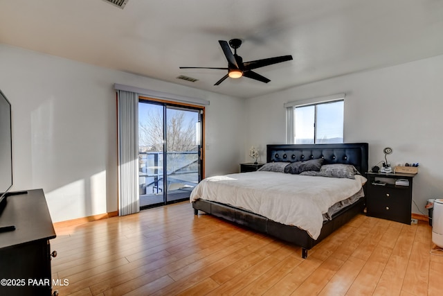 bedroom featuring access to exterior, visible vents, light wood finished floors, and a ceiling fan