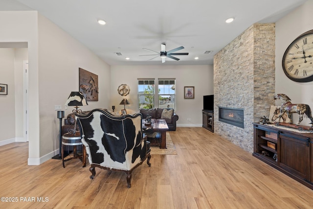 1450 Henry Dr, Chino Valley, AZ 86323 - living area with light wood-style floors, a ceiling fan, a fireplace, baseboards, and recessed lighting