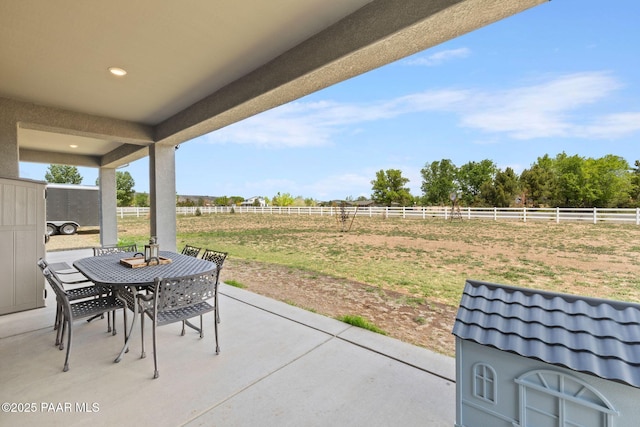 1450 Henry Dr, Chino Valley, AZ 86323 - view of patio / terrace featuring outdoor dining area, fence, and a view of countryside
