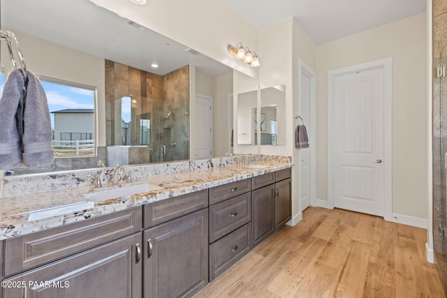 1450 Henry Dr, Chino Valley, AZ 86323 - full bath featuring a shower stall, wood finished floors, double vanity, and baseboards