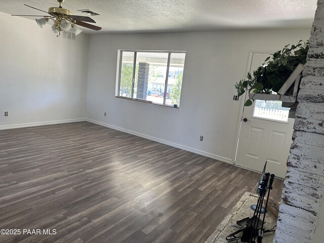 2532 Huron St, Dewey-Humboldt, AZ 86329 - entrance foyer featuring dark wood-style floors, a textured ceiling, and a ceiling fan