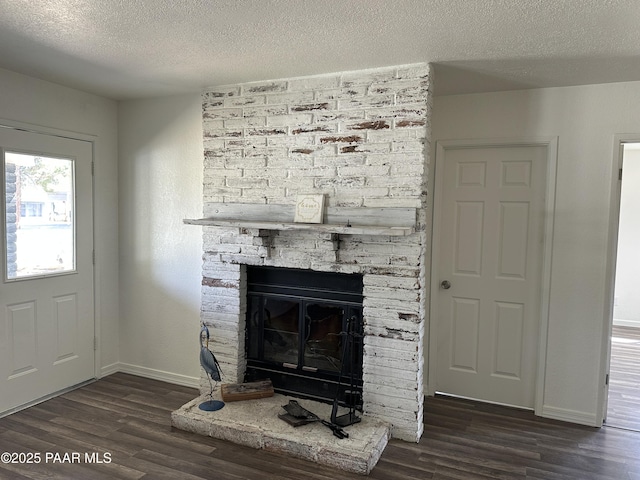 2532 Huron St, Dewey-Humboldt, AZ 86329 - detailed view of wood finished floors, a textured ceiling, and a stone fireplace