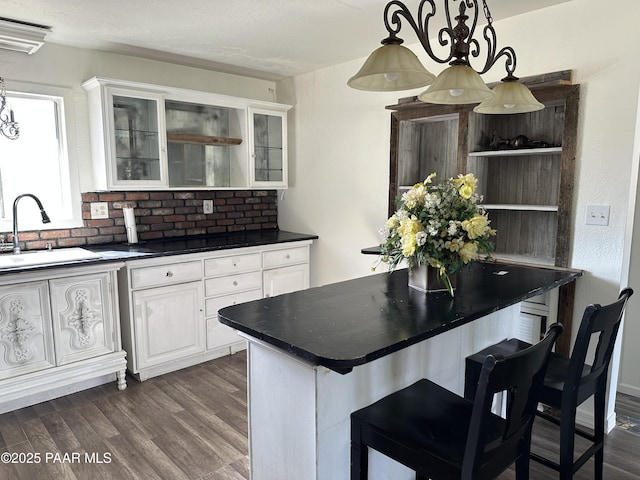 2532 Huron St, Dewey-Humboldt, AZ 86329 - kitchen featuring open shelves, dark countertops, dark wood finished floors, and white cabinetry