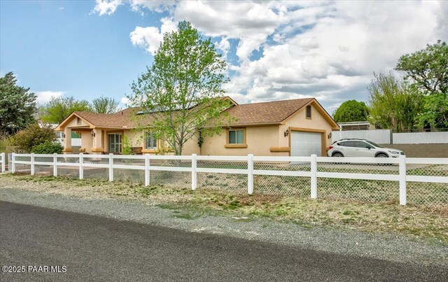 2770 Azurite St, Dewey-Humboldt, AZ 86327 - ranch-style home featuring stucco siding, a fenced front yard, and a garage