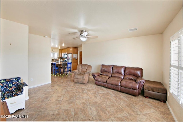 2770 Azurite St, Dewey-Humboldt, AZ 86327 - living area with healthy amount of natural light, ceiling fan, and baseboards