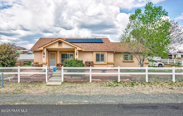 2770 Azurite St, Dewey-Humboldt, AZ 86327 - view of front of property with stucco siding, solar panels, roof with shingles, and a fenced front yard