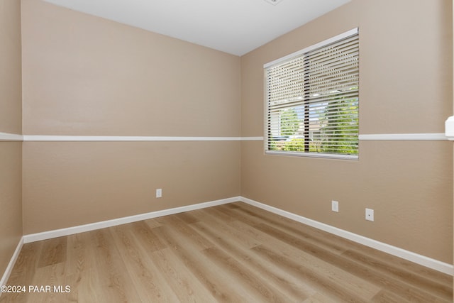 spare room featuring hardwood / wood-style flooring