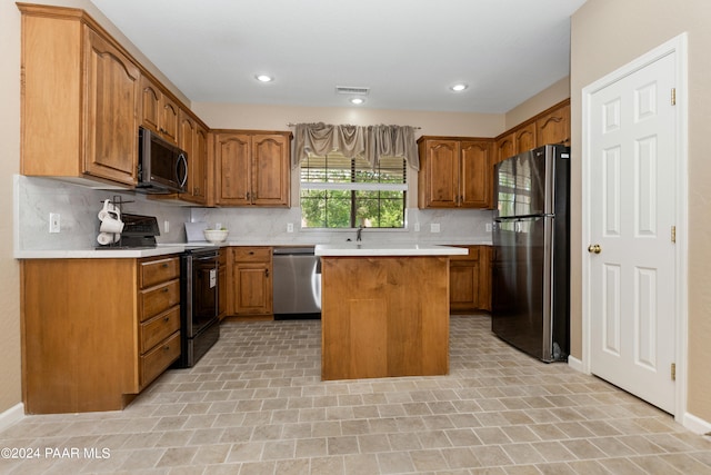 kitchen with a center island, stainless steel appliances, and tasteful backsplash