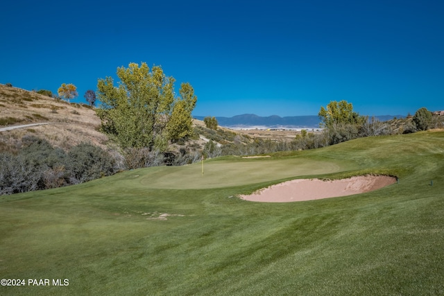 surrounding community featuring a mountain view and a yard