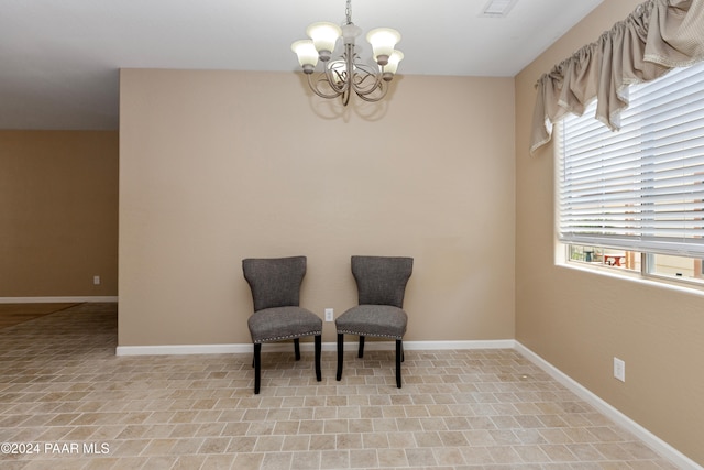 sitting room with a chandelier