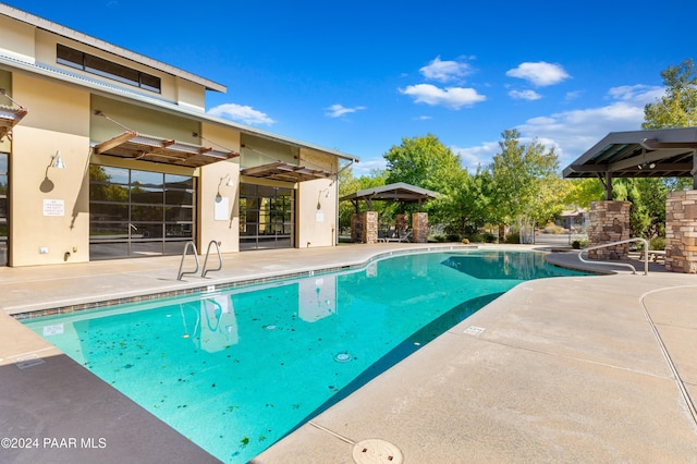 view of pool featuring a patio