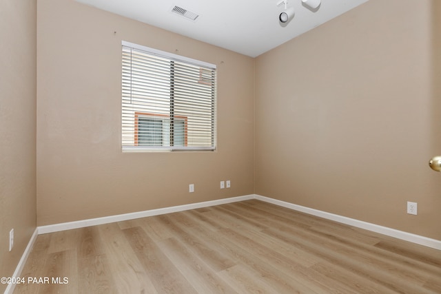 unfurnished room with light wood-type flooring