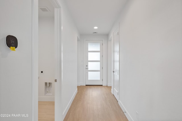 hallway with light wood-type flooring