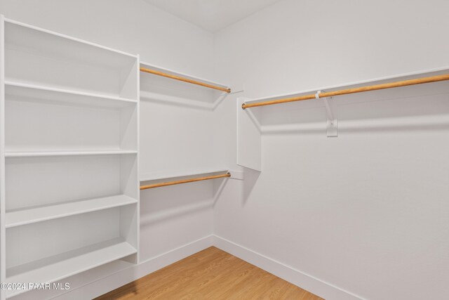 walk in closet featuring hardwood / wood-style floors