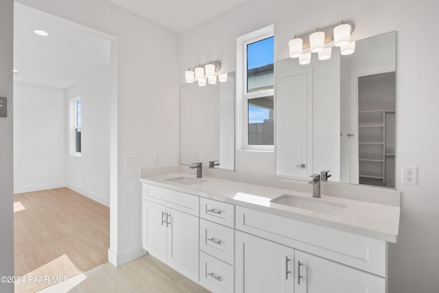 bathroom featuring vanity and wood-type flooring