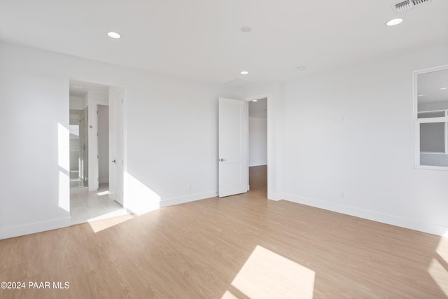 spare room featuring light wood-type flooring