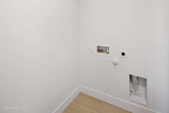 laundry area featuring washer hookup, electric dryer hookup, hookup for a gas dryer, and tile patterned flooring