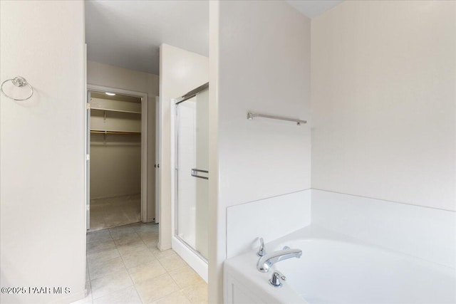 bathroom with tile patterned floors and plus walk in shower