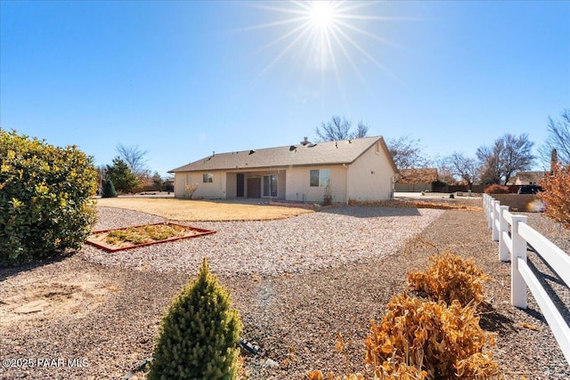back of property with a patio