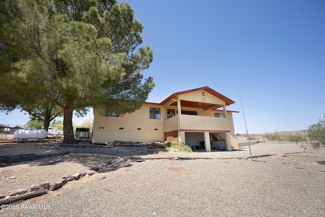 17571 E Hummingbird Ln, Mayer, AZ 86333 - view of front of home featuring a balcony, central AC unit, and stucco siding