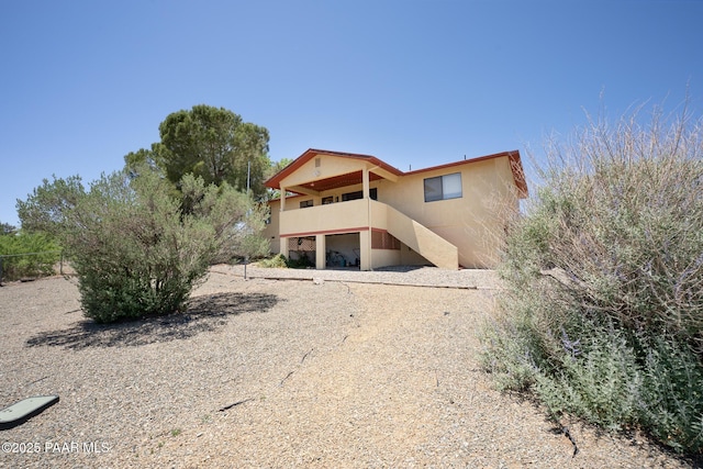 17571 E Hummingbird Ln, Mayer, AZ 86333 - back of property with stairs and stucco siding