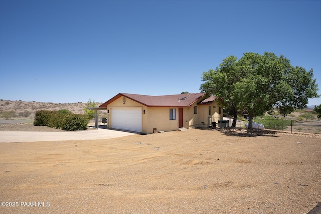 17571 E Hummingbird Ln, Mayer, AZ 86333 - view of front of property featuring concrete driveway, an attached garage, and central AC unit