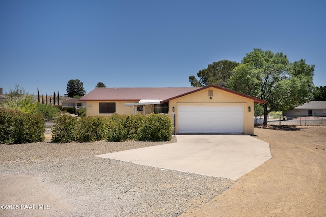 17571 E Hummingbird Ln, Mayer, AZ 86333 - ranch-style house with driveway, an attached garage, and stucco siding