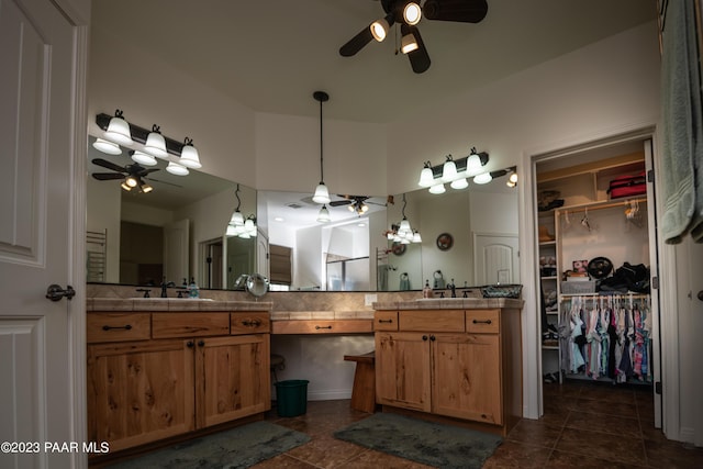 bathroom with ceiling fan, tile patterned flooring, and vanity