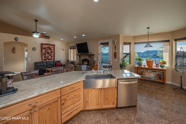 kitchen with dishwasher, a healthy amount of sunlight, vaulted ceiling, and sink