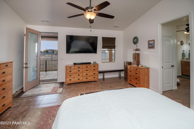 bedroom featuring access to exterior, ceiling fan, dark tile patterned floors, ensuite bathroom, and lofted ceiling