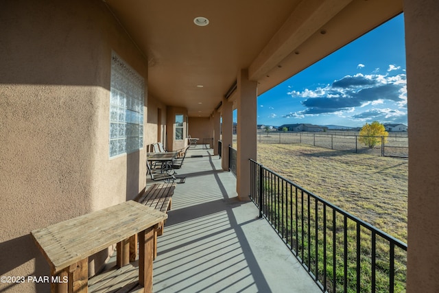 balcony featuring a mountain view and a rural view