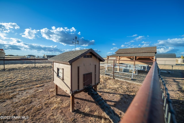 view of outbuilding featuring a rural view