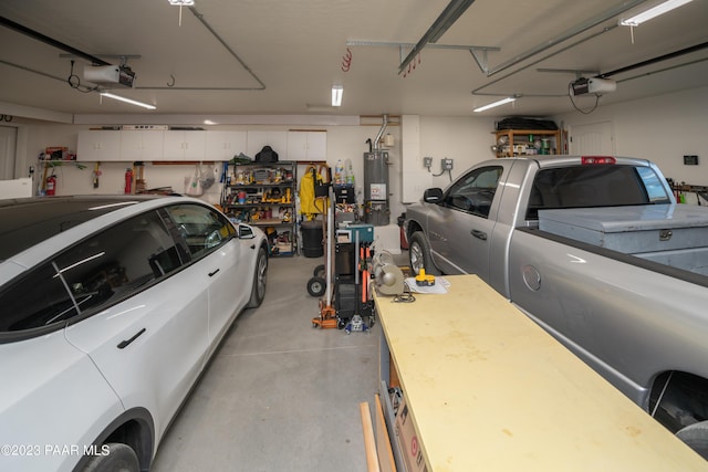 garage featuring a workshop area, gas water heater, and a garage door opener