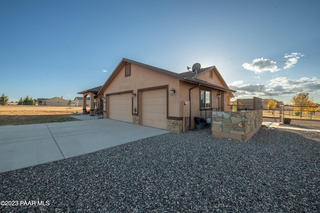 view of side of property featuring a garage