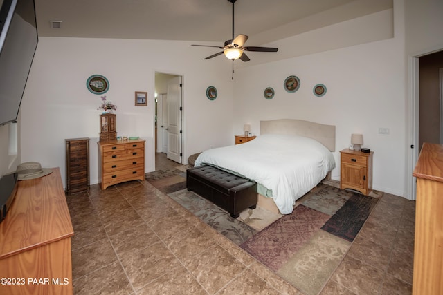 bedroom featuring tile patterned floors, ceiling fan, and lofted ceiling