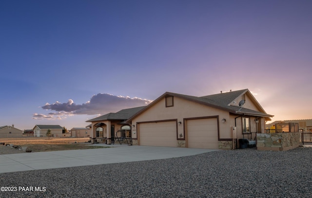 single story home featuring a garage