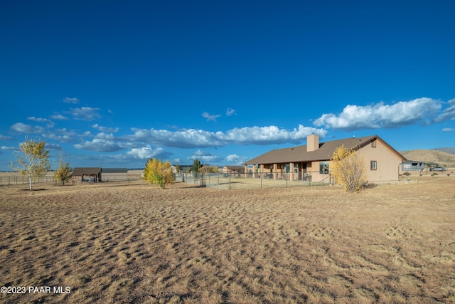 view of yard with a rural view