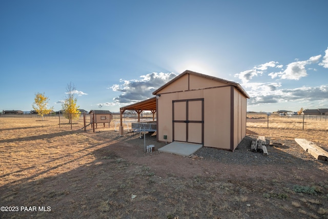 view of outbuilding with a rural view